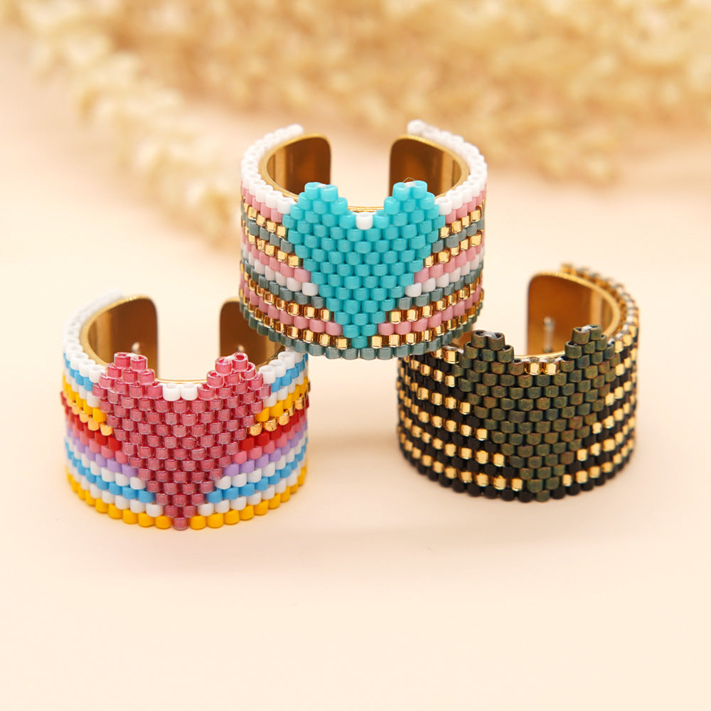 Close-up of adjustable beaded cuff ring in vibrant colors
