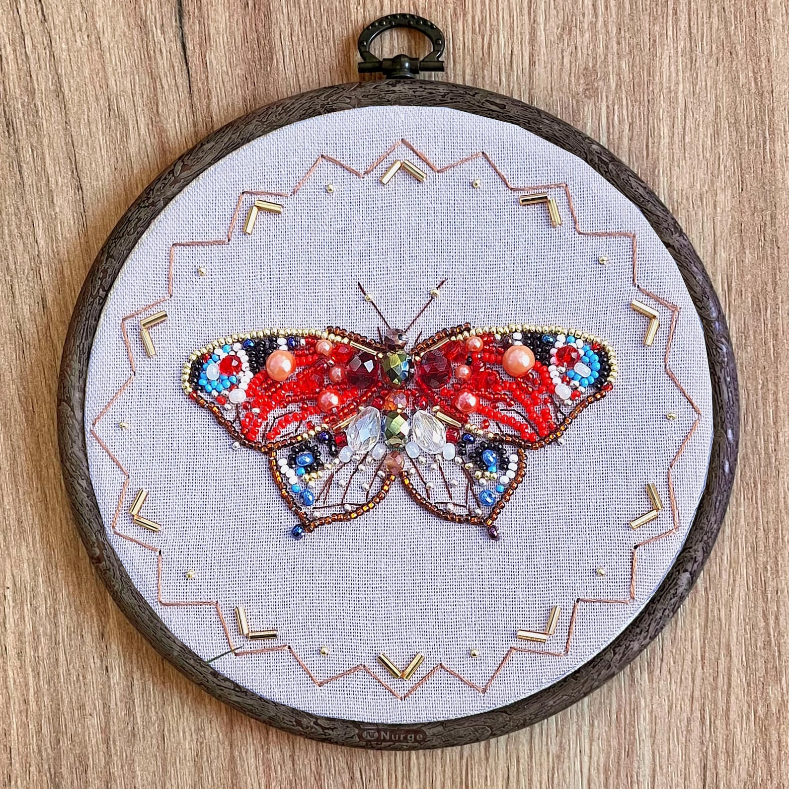 Embroidered butterfly with metallic and green beads