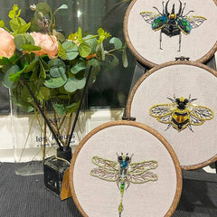 Insect-themed embroidery with beads and sequins
