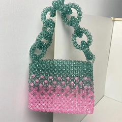 Model carrying a Evening clutch bags