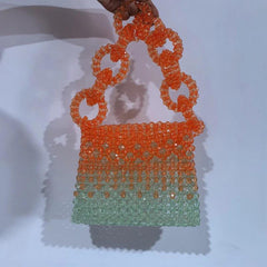 gradient beadwork on a designer clutch bags